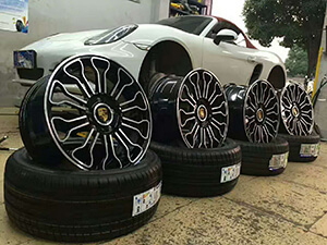 Black porsche wheels for white porsche vehicle